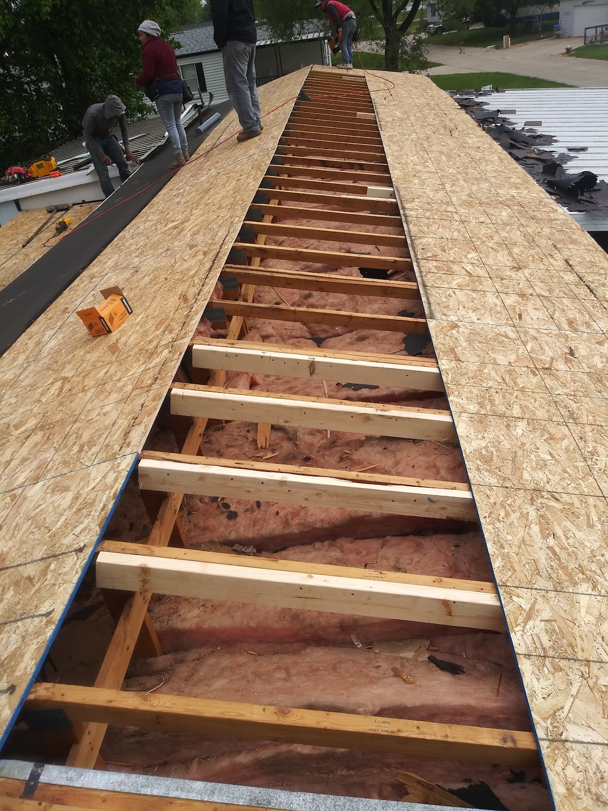 Sunrise Roofing crew rebuilding a roof deck